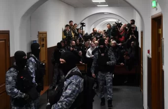 Russian court charges four men with terrorism in Moscow attack.